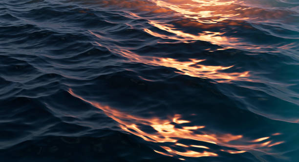 istock Sun Glare on the Dark Water Surface. Abstract Background 1313997563
