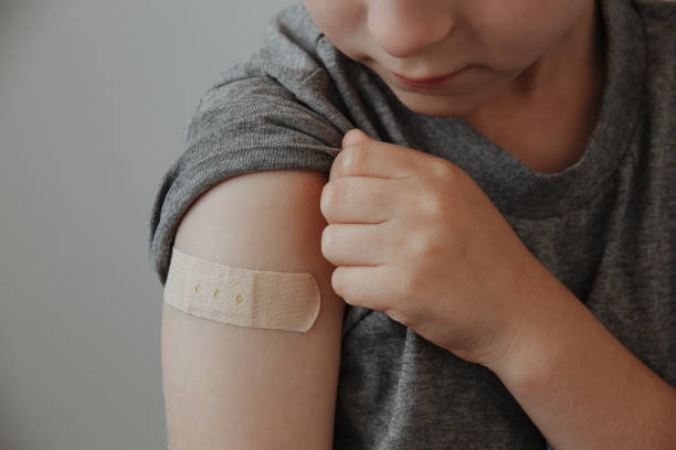 istock Vaccinated Boy Showing Arm After Covid-19 Vaccine Injection 1313998982