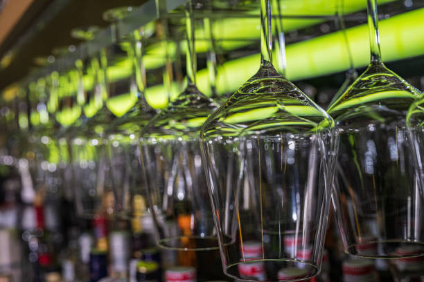 Wine glasses arranged in bar