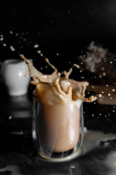 istock Coffee drink with splashes in dark background 1314000033