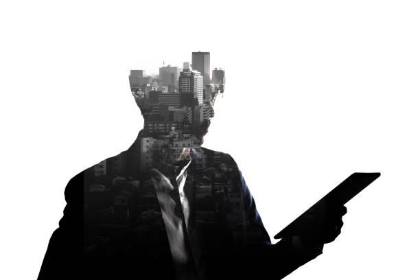 istock Double Exposure businessman use tablet and skyscraper building city isolate on white background. 1314000423