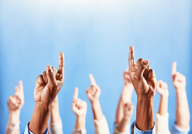 istock Many fingers pointing upward to heaven 1314001577