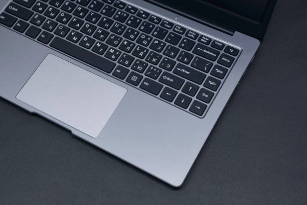 istock Open laptop on a black background close-up. 1314002873