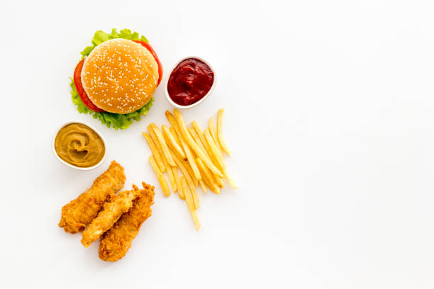 istock Fast food flat lay set. Burger with fried potatoes and chicken, top view 1314007116