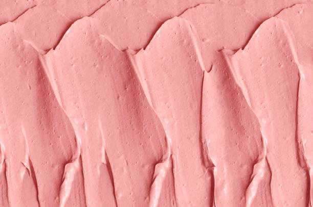 istock Rose cosmetic clay (alginate facial mask, face cream, body wrap) texture close up, selective focus. Abstract background with brush strokes. 1314007185