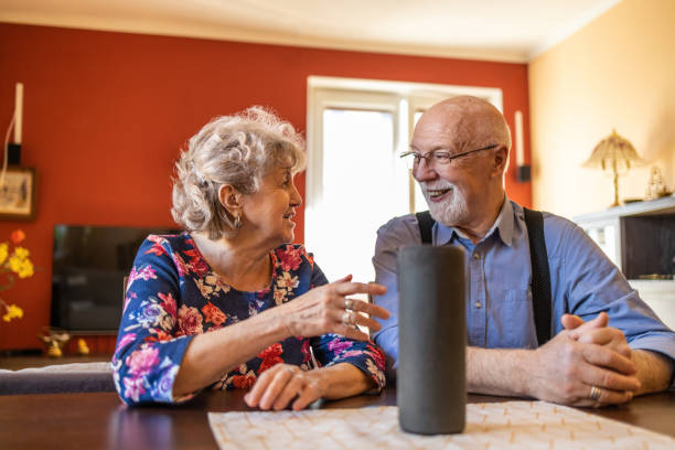 istock Excited senior couple using a Virtual Assistant at home 1314007223