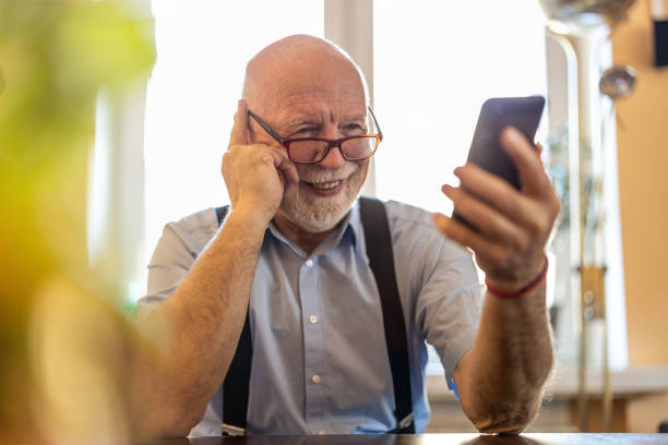 istock Shot of a senior man using a mobile phone at home 1314008006