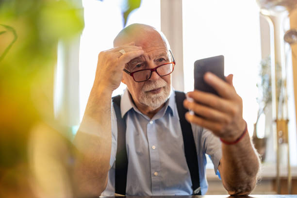 istock Senior man staring at his smartphone in confusion 1314008017