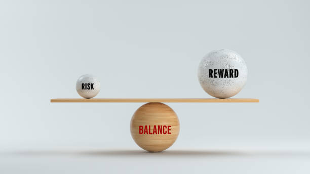 Concept of balancing Reward versus Risk in business and life"n - 3d illustration Concept of balancing Reward versus Risk in business and life with three spheres with text arranged as a see-saw in balance over a grey background - 3d illustration incentive stock pictures, royalty-free photos & images