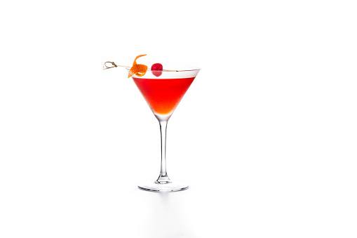 Traditional Manhattan cocktail with cherry isolated on white background