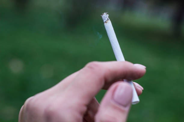 istock Cigarette in the woman hand 1314008651