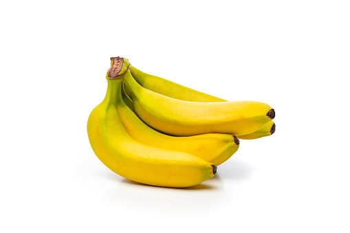 Some ripe bananas on the black background