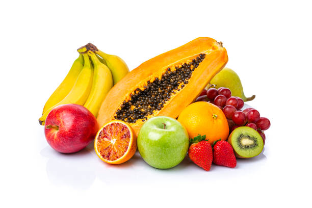 istock Whole and halved fruits shot on white background 1314012132