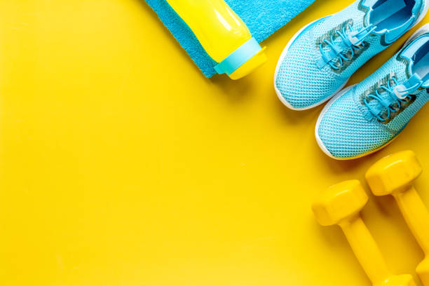 istock Athlete equipment with dumbbells and sneakers. Overhead view 1314015026