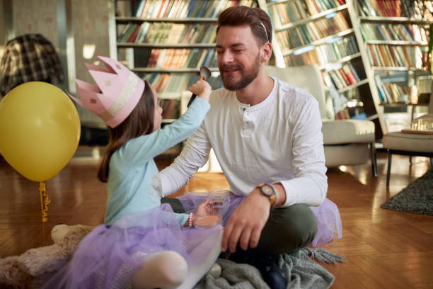 istock Cheerful father and daughter playing together 1314017475