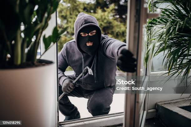 Robber Breaking In House Stock Photo - Download Image Now - Thief, Burglary, Stealing - Crime