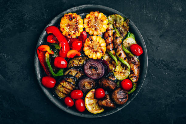 istock Grilled vegetables in bowl on dark stone background, top view. 1314018478