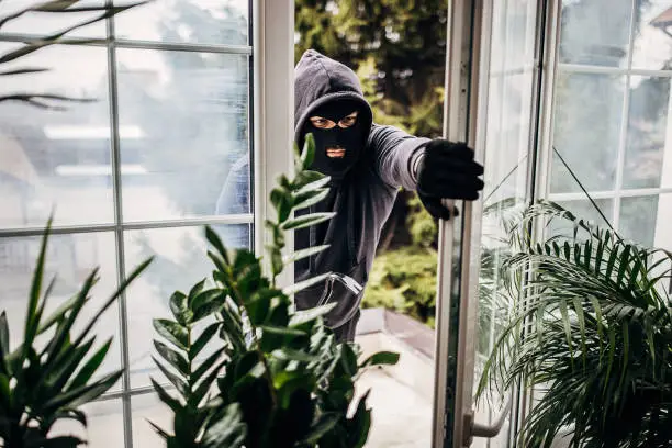 Photo of Robber breaking in house