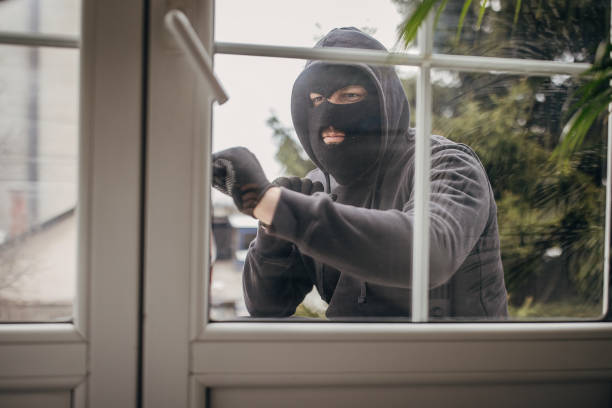 istock Robber trying to brake in house 1314018638