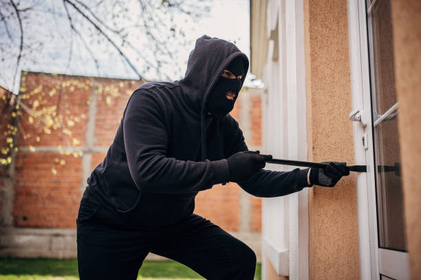 istock Criminal trying to brake in house 1314018683