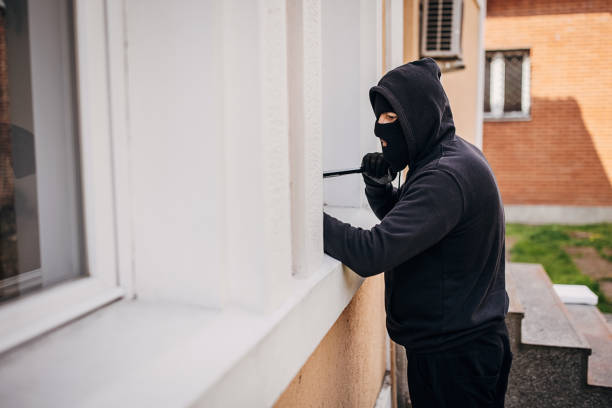 istock Robber trying to brake in house 1314019277