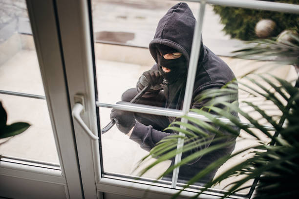 istock Criminal trying to brake in house 1314019337