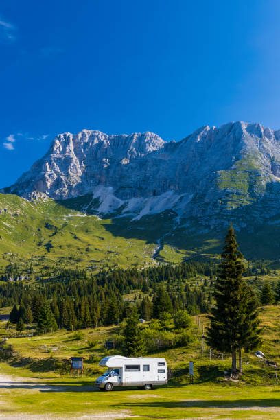 istock Caravan in summer mountain landscape, Alps, Italy 1314020668