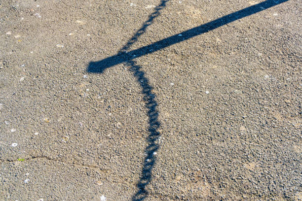 Rough background with texture and shadow from fence post with chain