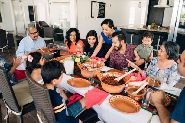 istock Multi-generation family eating together outdoors 1314027122