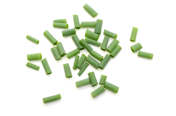 istock Chopped green Onion leaves isolated on white 1314028236