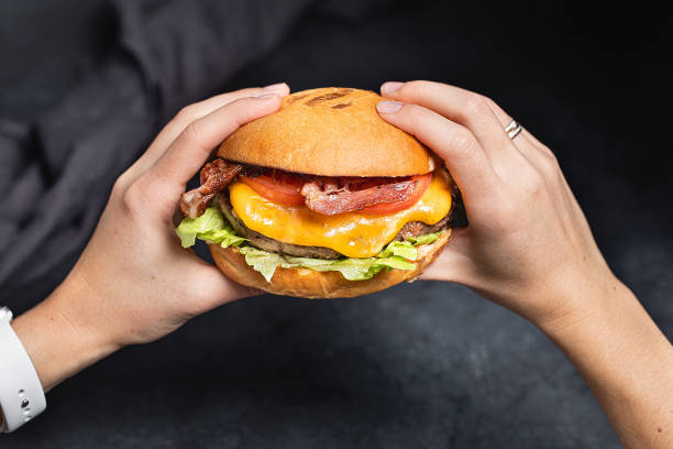 istock Cheese burger with bacon on black dark background 1314028306