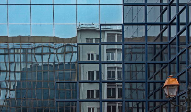 istock Post-war apartment building reflected in a modern glass one, Athens, Greece. 1314030117