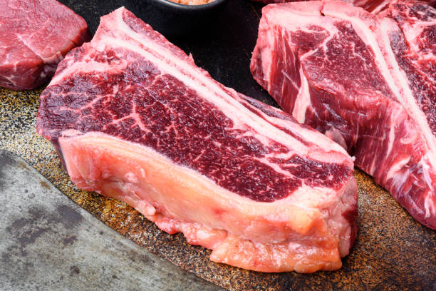 istock Raw beef steak, Club steak cut, on old dark rustic background 1314030177