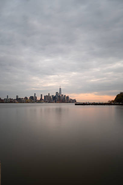 istock Lower Manhattan from Hoboken, NJ on a cloudy evening 1314036835