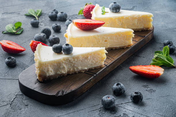 istock Homemade cheesecake with fresh berries, on gray background 1314037613