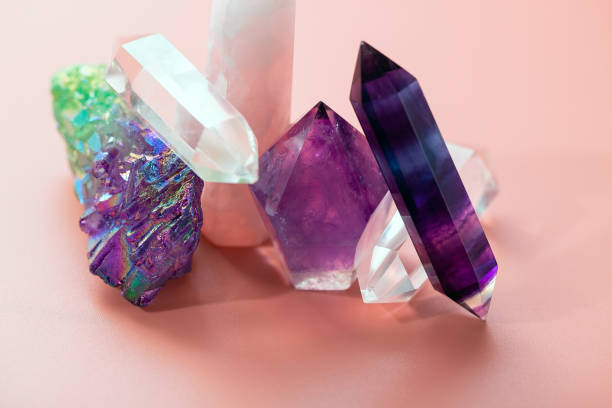 istock Various crystals for healing and magical practices. Faceted amethyst, rose quartz, fluorite, rock crystal, a cluster of quartz on a pastel pink background 1314038157