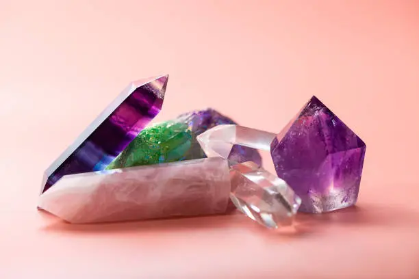 Faceted amethyst, rose quartz, fluorite, rock crystal, quartz cluster taken close up