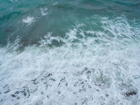 Beautiful view of ocean waves and a fantastic rocky shore, Sea patterns, background wallpaper.