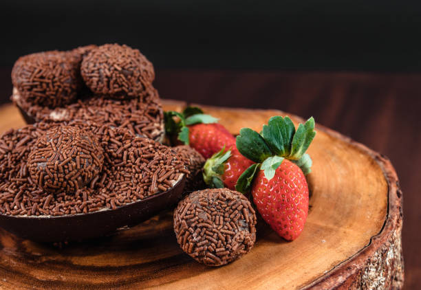 istock Chocolate Easter Egg filled with brigadeiro (brigadier) and strawberries 1314042117