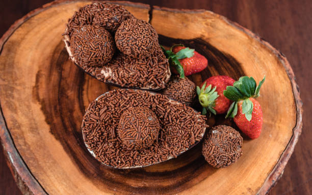istock Chocolate Easter Egg filled with brigadeiro (brigadier) and strawberries 1314042262