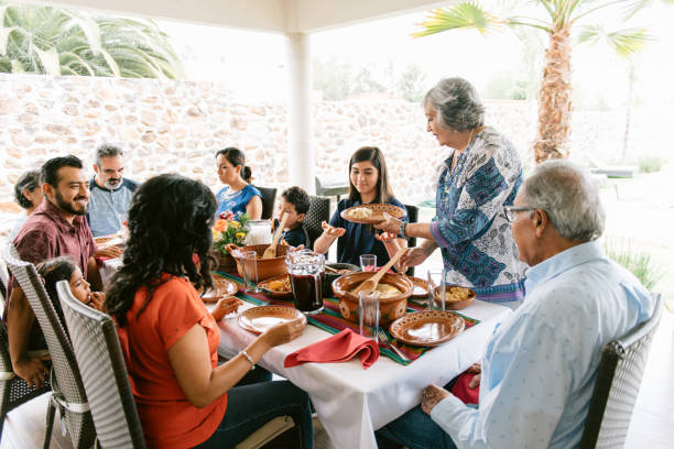 istock Multi-generation family eating together outdoors 1314042270
