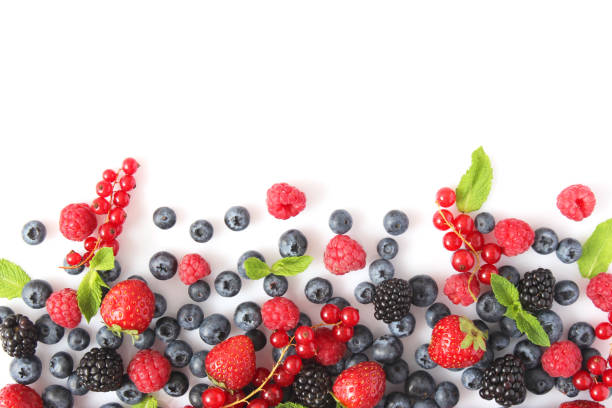 istock wild berries and mint leaves on a white background top view. 1314044154