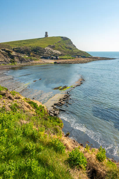 View over Kimmeridge Bay beach with tower in the distance