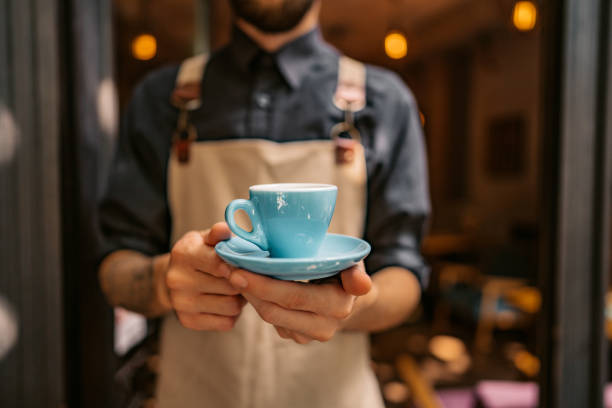 Barista serving coffee