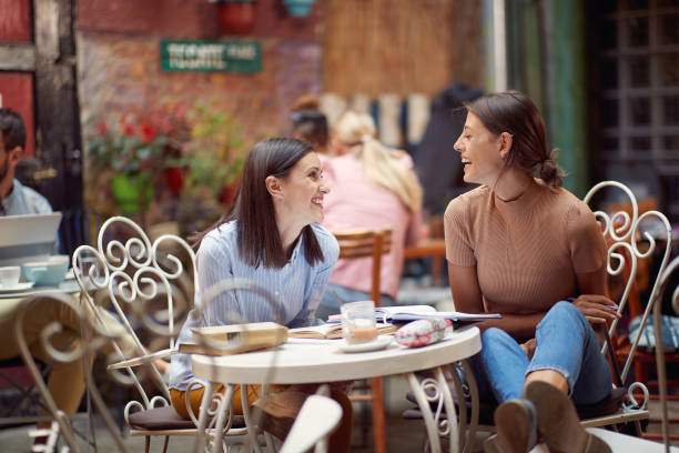 istock Two female students having a good time while have a drink in bar's garden. Leisure, bar, friendship, outdoor 1314046355