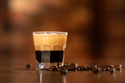 tasty coffee shot on wooden bar table