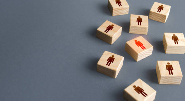 istock Red highlighted man among randomly people blocks. Recruiting, staffing. Human resources. Hiring talented professional candidate for a vacant job position. Employment agency. Finding infected people. 1314046569