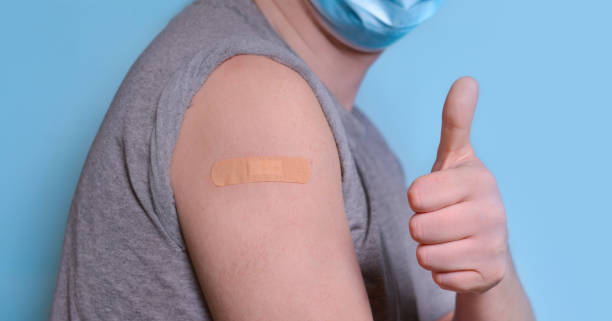 istock A man with a plaster on his shoulder has received a coronavirus vaccine and shows an ok gesture, approving the coronavirus vaccination. The concept of vaccination, antiviral immunization promotion 1314048048