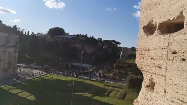 Photo of High arch built with bricks in the Colosseum in Rome