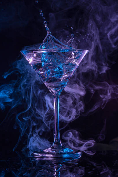 istock Splashing martini in smoky backdrop 1314049435